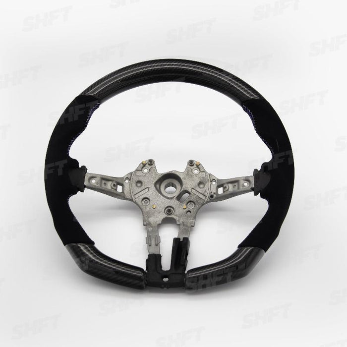 R44 BMW FLAT BOTTOM STEERING WHEEL IN GLOSS CARBON WITH MOLDED ALCANTARA GRIPS