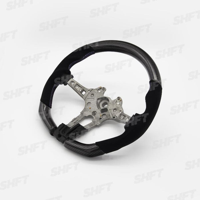 R44 BMW FLAT BOTTOM STEERING WHEEL IN GLOSS CARBON WITH MOLDED ALCANTARA GRIPS